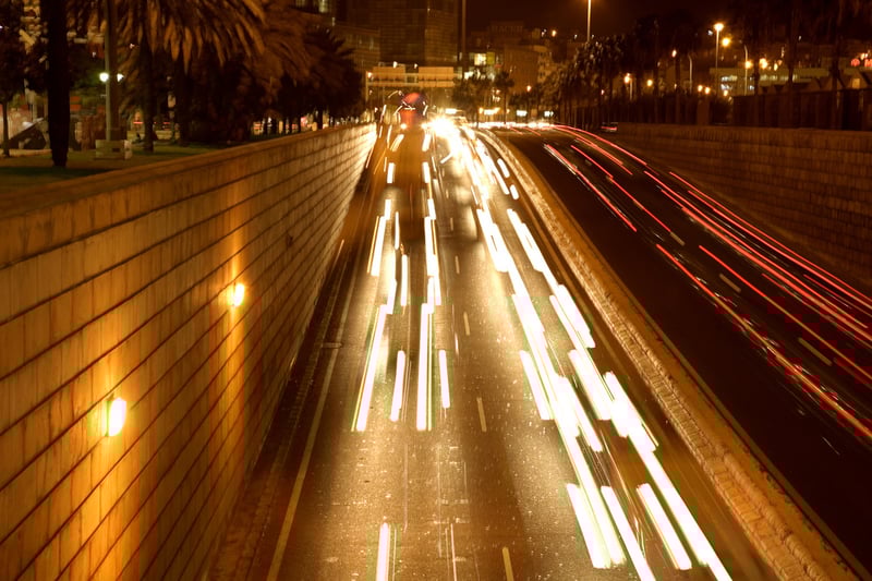 moving traffic at night with moving lights